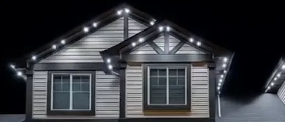 Permanent LED roofline lights in colour-matched track on a gable roof