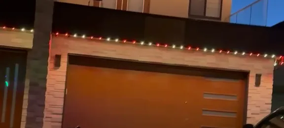 Close-up of installed lights along the fascia of a modern home, at night